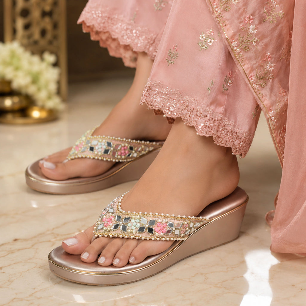 Pair of Riwaaz Pastel Bloom dull rose gold mirror mosaic wedge sandals on grey background
