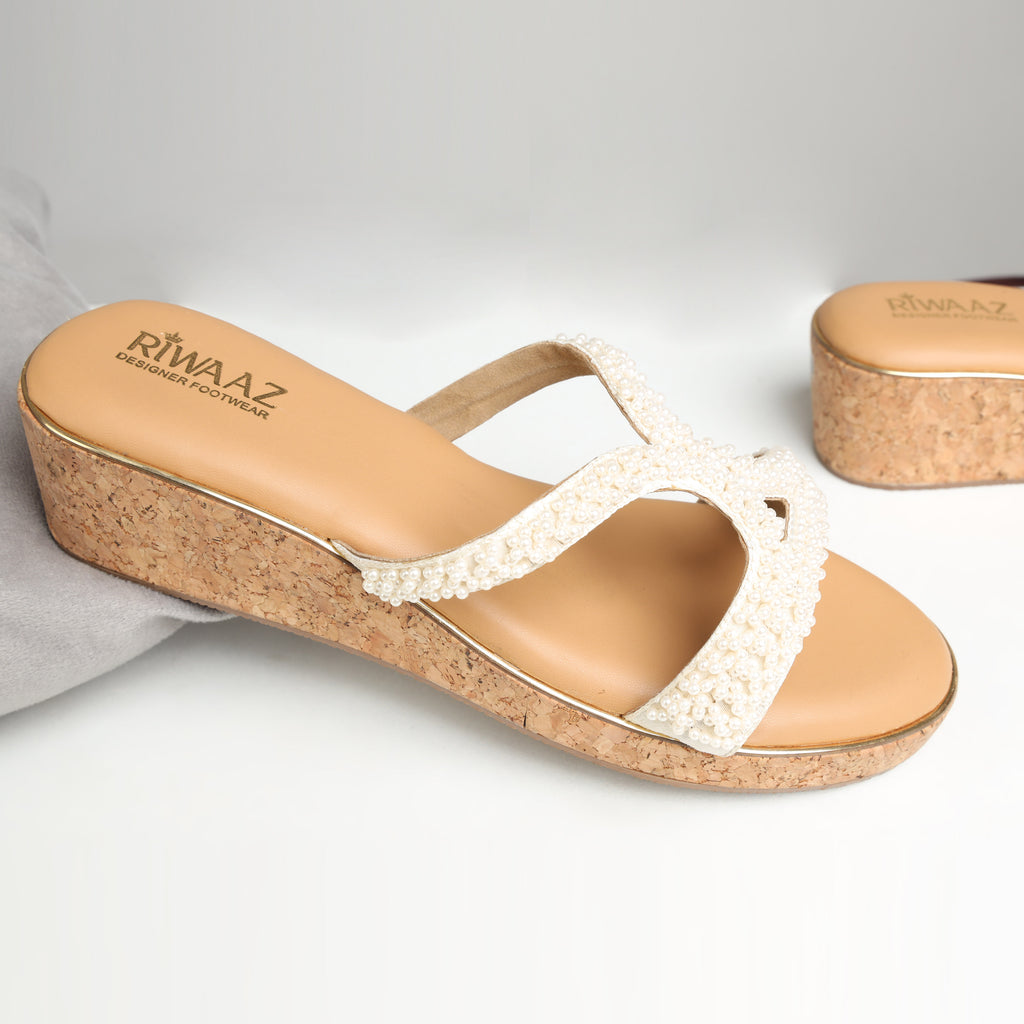 Riwaaz Pearl Royale dark beige pearl embellished crossover strap wedge sandals on grey background