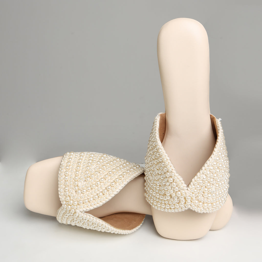 Riwaaz Noor-e-Moti white pearl flat slides – angled product shot showing pearl embellishment detail and cushioned footbed
