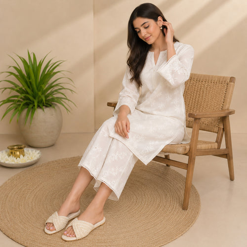 Side view of Riwaaz Noor-e-Moti pearl flat slides showing full pearl coverage on crossover strap and flat rubber sole