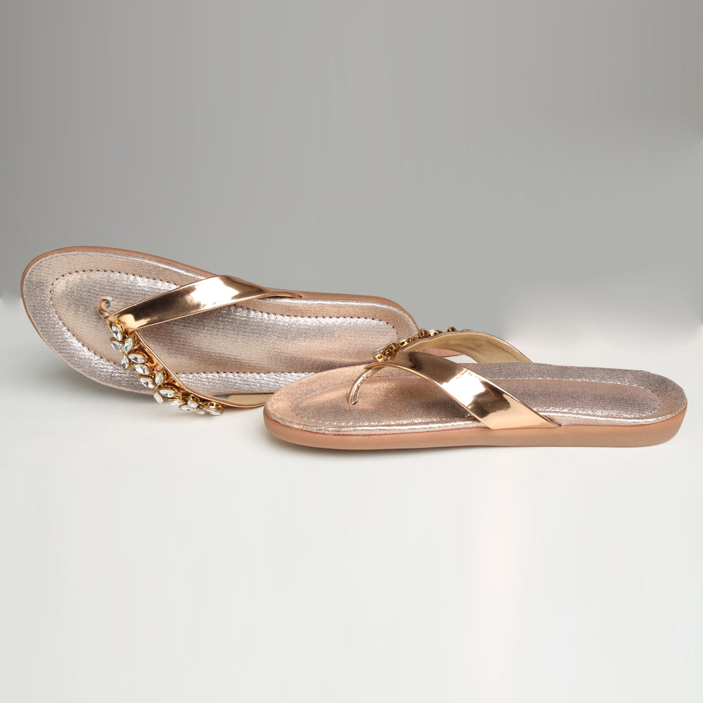 Single Riwaaz Ziva dull rose gold Kundan flip flop – angled product shot showing Kundan crystal embellishment and shimmer footbed
