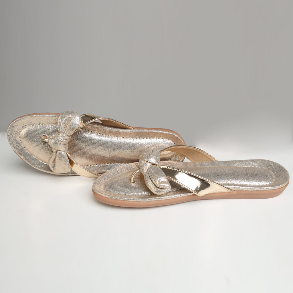 Pair of Riwaaz Misha dull rose gold mirror work flip flops – flat lay top view showing full shimmer footbed and bow detail