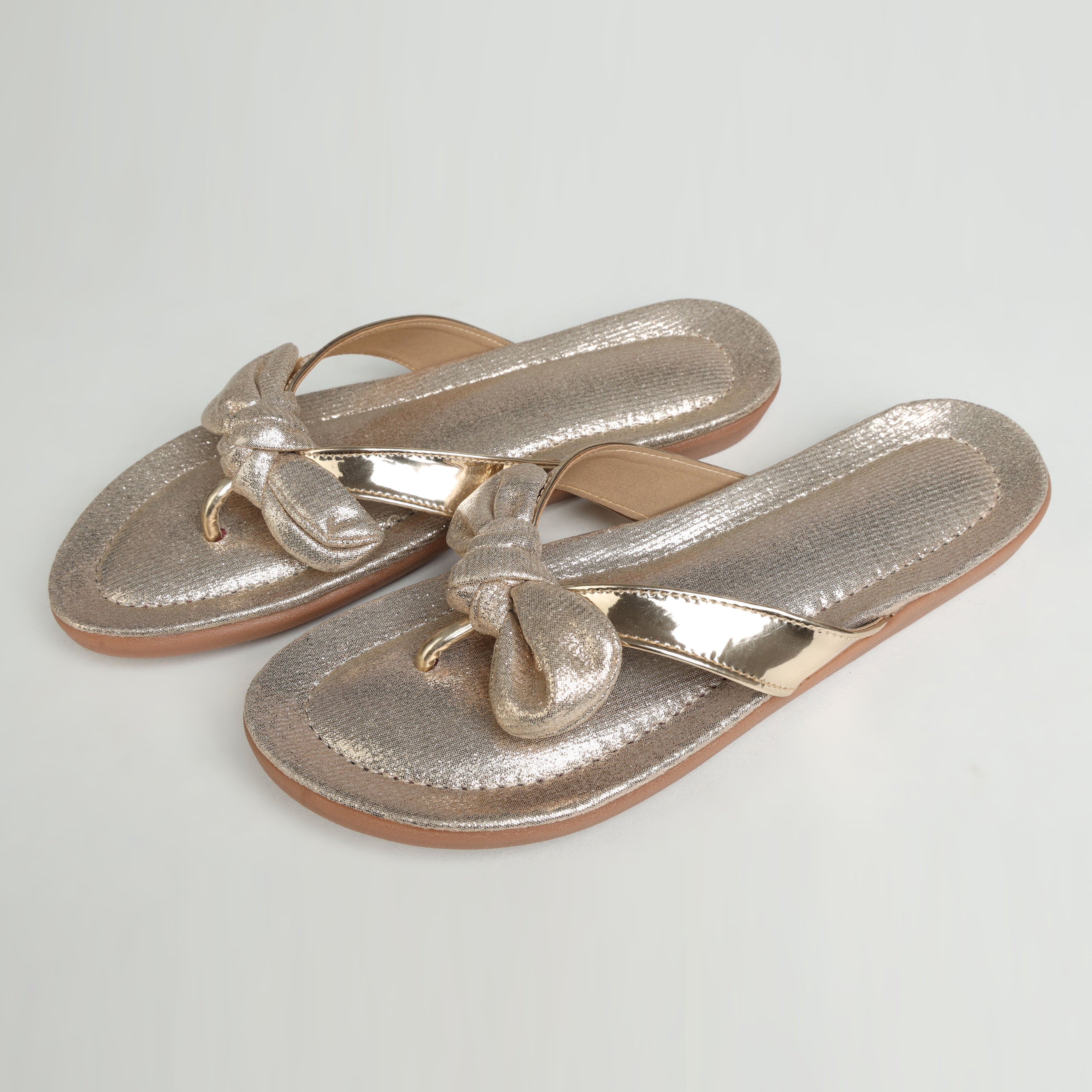 Riwaaz Misha dull rose gold mirror work flip flops – pair laid flat on white background showing rubber sole and metallic insole