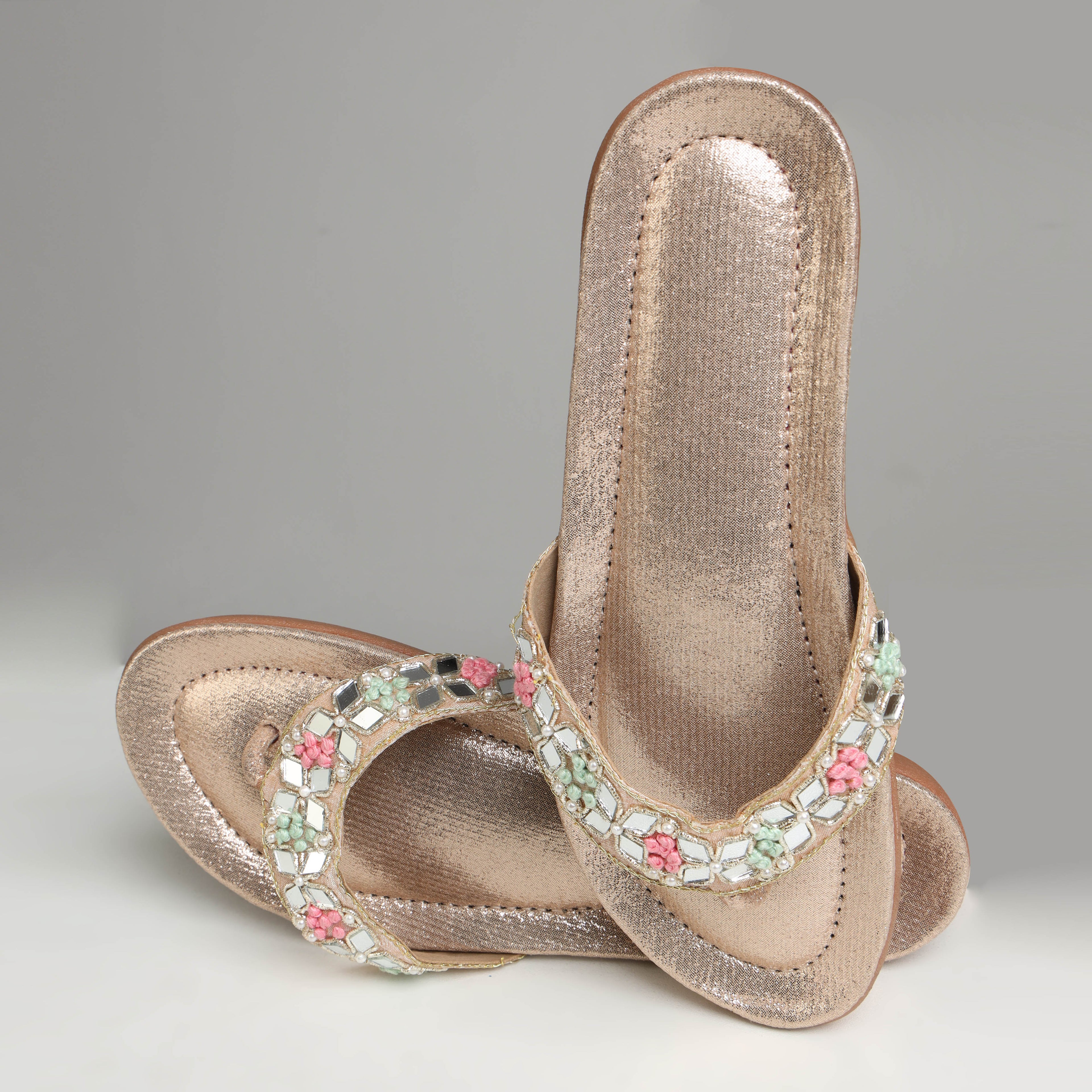 Single Riwaaz Misha dull rose gold mirror work flip flop – top view showing full mirror work strap with pink and mint French knot flower clusters