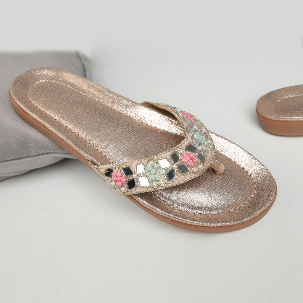 Riwaaz Misha dull rose gold mirror work flip flops – top-down product shot showing shimmer insole and mirror work strap detail on white background